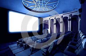 Cinema theater showing empty white movie screen