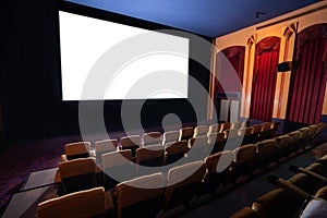 Cinema theater showing empty white movie screen.