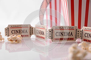 Cinema ticket and popcorn white background detail