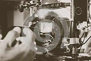 cinema video camera on tripod in film studio.
