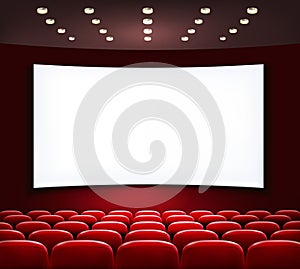 Cinema with white screen and seats.