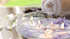 Cinemagraph - Burning candles in water. Composition of the spa.