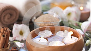 Cinemagraph - Burning candles in water. Composition of the spa.
