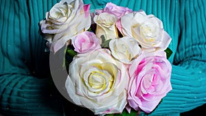 Cinemagraph of close-up of woman holding bouquet of roses