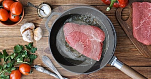 Cinemagraph - Cooking steak in a frying pan.