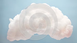 Cinemagraph of fluffy white cloud gently rocking in blue sky