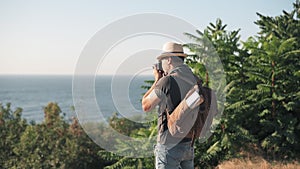 Cinemagraph- Happy male tourist with a backpack.