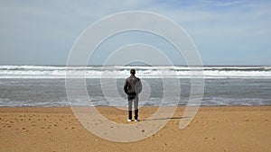 Cinemagraph of man at beach contemplating the sea