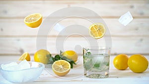 Cinemagraph - Pouring the lemon juice into a glass with ice and mint