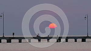 Cinemagraph - Sun Setting over the Sea Pier