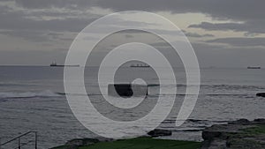 Cinematic coastline panorama at Estoril beach, Cascais, Portugal at dusk in calm weather