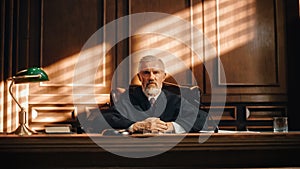 Cinematic Court of Law and Justice Trial: Portrait of Impartial Male Judge Listening To the Pleaded