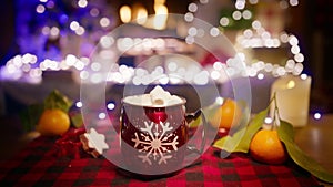 Cinematic shot on RED camera cup of hot chocolate with marshmallows at fireplace