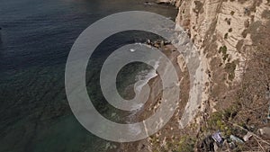 Cinematic waves in slow-motion against rocky mountain - Sabah Nassar\'s Rock at Raouche in Beirut, Lebanon