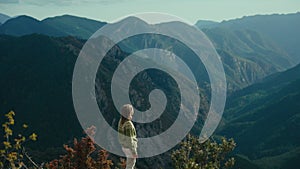 Cinematic woman in traditional sweater in mountain