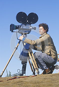 Cinematographer setting up his camera