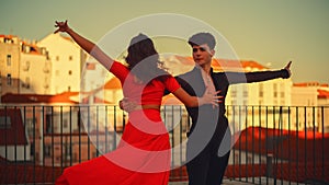 cing a Latin Dance Outside the City with Old Town in the Background. Sensual Dance by Two