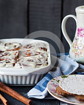 Cinnabon buns with cinnamon and nuts in baking dish