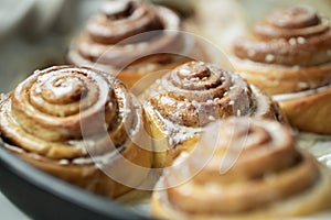 Cinnabon. Homemade glazed buns with sesame and cinnamon. delicious pastries or a warm roll