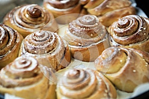 Cinnabon. Homemade glazed buns with sesame and cinnamon. delicious pastries or a warm roll