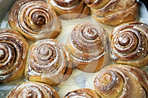 Cinnabon. Homemade glazed buns with sesame and cinnamon. delicious pastries or a warm roll