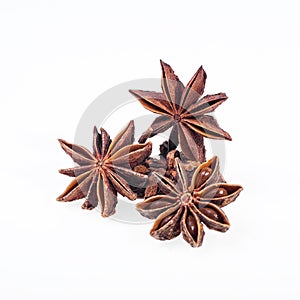 Cinnamon, anise and cloves on white background