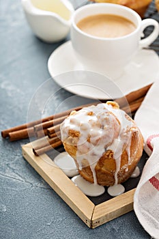 Cinnamon bun with glaze for breakfast photo