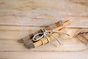 Cinnamon bundle on wooden background