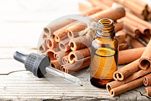 Cinnamon essential oil in the glass bottle