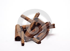 Cinnamon in the form of tubes on white background