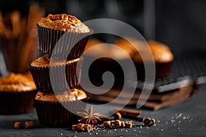 Cinnamon muffins on black background