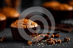 Cinnamon muffins on black background