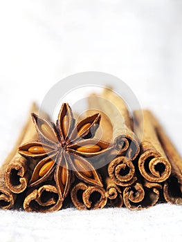 Cinnamon and poder on white and macro style spice cooking photo
