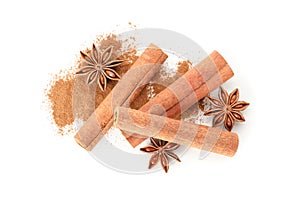 Cinnamon powder, sticks and anise isolated