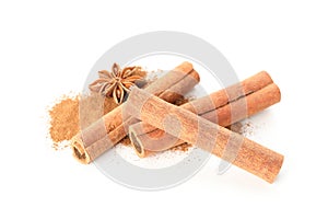 Cinnamon powder, sticks and anise isolated