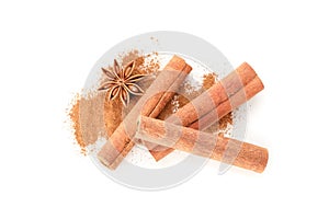 Cinnamon powder, sticks and anise isolated