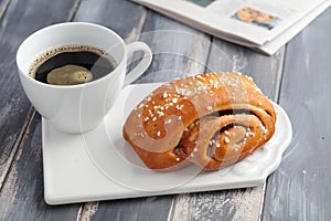 Cinnamon roll and a cup of coffee