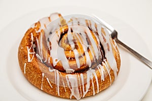 Cinnamon Roll on Plate with Fork