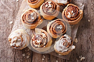 Cinnamon rolls with almond close up on the table. horizontal top