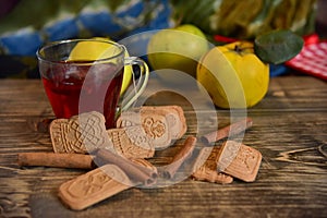 Cinnamon rols, fruits, cookies and cup of tea