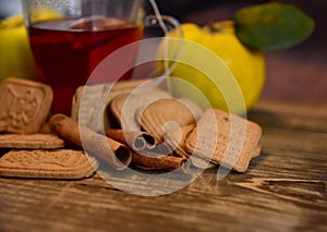 Cinnamon rols, fruits, cookies and cup of tea