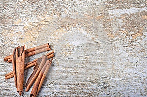 Cinnamon on rustic background