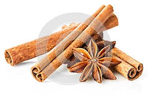 Cinnamon stick and star anise spice close-up isolated on white background.