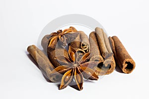 Cinnamon sticks and anise star isolated on white background close up.