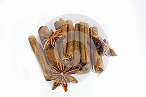 Cinnamon sticks and anise star isolated on white background close up.