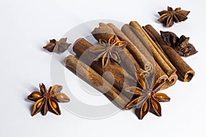 Cinnamon sticks and anise star isolated on white background close up.