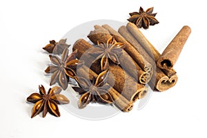 Cinnamon sticks and anise star isolated on white background close up.