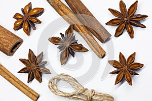 Cinnamon sticks and anise star isolated on white background close up.