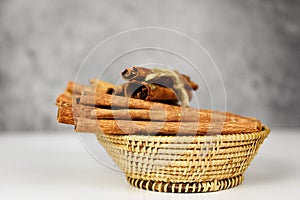 Cinnamon sticks on basket herbs and spices for cooked