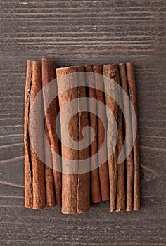 Cinnamon sticks on brown wooden table